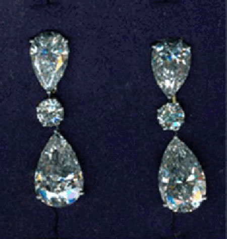 Graff Jewellers: White pearshape and round diamond earrings