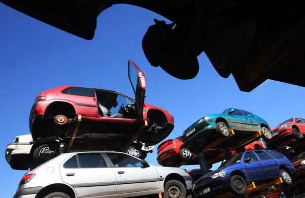 12 August 2009: Gloucester, UK: Cars are stacked for dismantling and recycling
