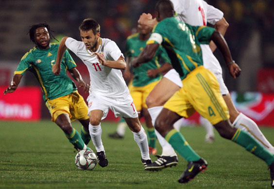 Football round the globe: Serbia's Milos Ninkovic breaks through the South African defence 
