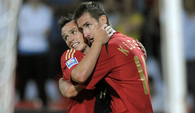 Football round the globe: Miroslav Klose celebrates with Piotr Trochowski 