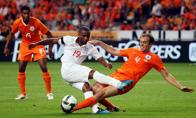 Netherlands v England: Joris Mathijsen slides in to take the ball off the toes of Jermain Defoe