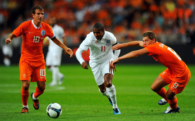 Netherlands v England: Ashley Young goes past Rafael Van der Vaart, left, and Stijn Schaars 