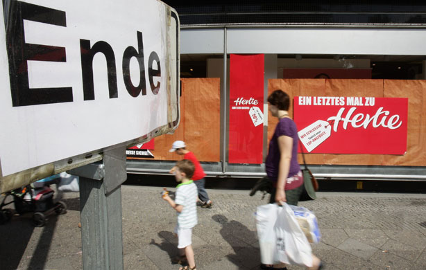 Week in Business: People walk past retail store Hertie in Berlin, Germany