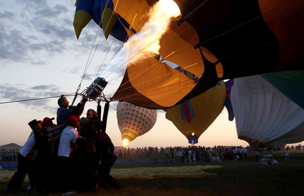 13 August 2009: Baotou, China: Contestants prepare their hot air balloons