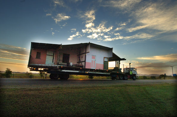 13 August 2009: Townsville, Australia: A house being moved on a trailer