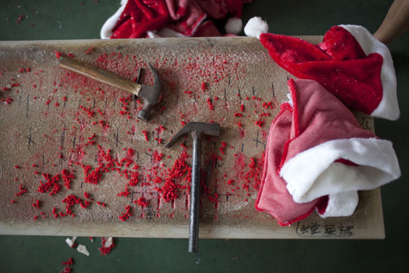 Christmas production line: Santa hats are made at the Yiwu Spaceflight craftwork company in China