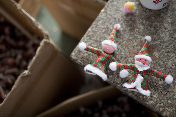 Christmas production line: Small Santa figures are assembled in Yiwa, China