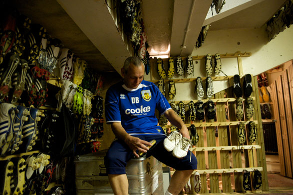 Burnley Premier League: Kit manager Daryl Bielby cleans some boots