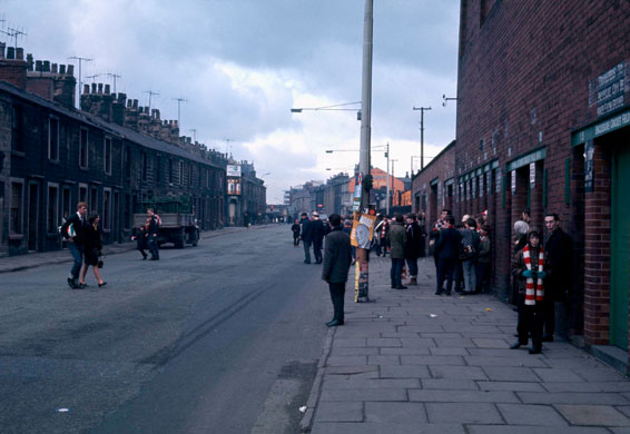 Burnley Premier League: Fans hang around in Burnley street outside of Turf Moor.
