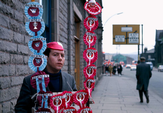 Burnley Premier League: A rosette seller stands on the street outside the stadium 
