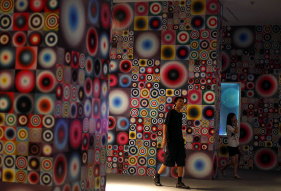 24 hours in pictures: Beijing, China: Visitors at an art installation during the Art Biennale 