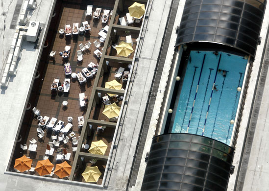 24 hours: Sunbathers relax on a rooftop in Boston