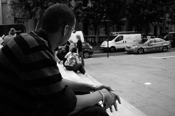 jenquest assignment: man looking at a police car