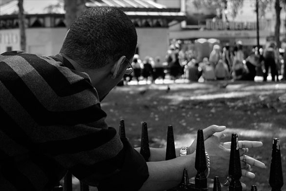 jenquest assignment: man looking on at a group of people