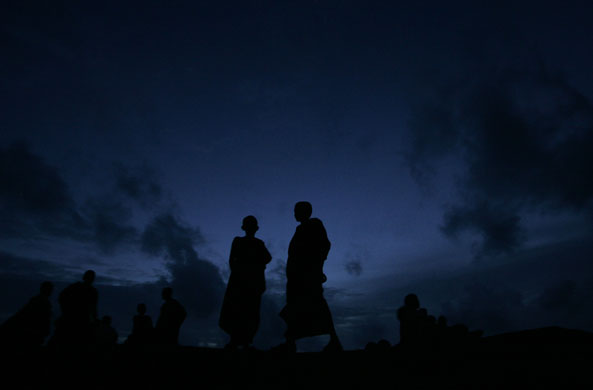 18 August 2009: Galle, Sri Lanka: Buddhist monks spend the evening by the sea front