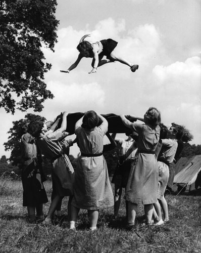 Girl guides 100th: 1955 tossing in a blanket at the annual Girl Guide Camp