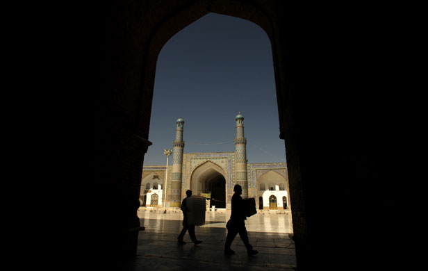 Afghanistan elections: Herat: Election workers carry ballot boxes to a polling station at a mosque