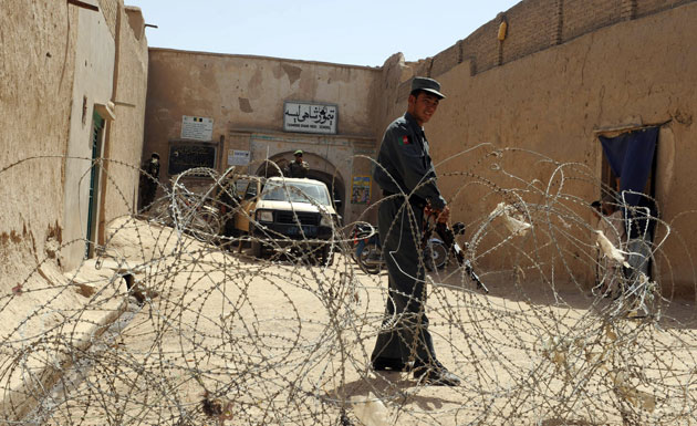 Afghanistan elections: Kandahar: Policemen secure a polling station at a school 