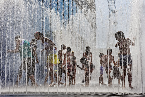 UK weather: Children play in the fountains outside the Hayward Gallery