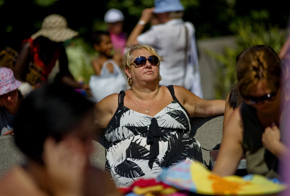 UK weather: A woman sunbathes outside the Hayward Gallery on the South Bank, London