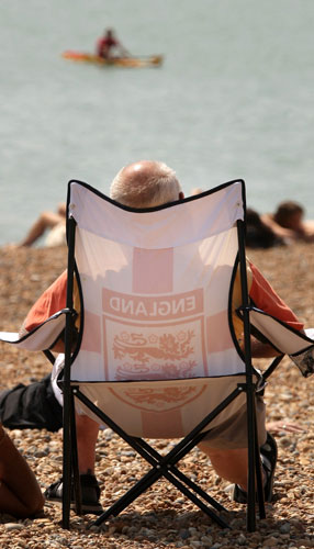UK weather: A man in an England chair enjoys the sun on the sea front in Hastings