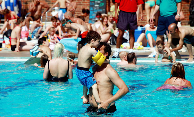 UK weather: Sunbathers enjoy the hottest day of the summer in London Fields Lido
