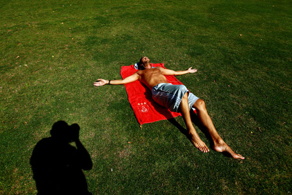 UK weather: A sunbather at London Fields