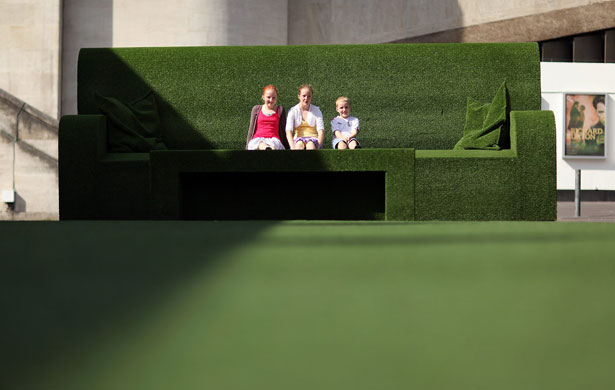 UK weather: Children relax on giant sofas on the South Bank, London