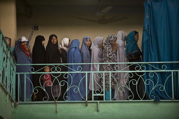 Elections in Afghanistan: Women wait to cast their ballots inside a polling centre in Kabul