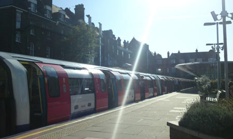 A London Underground tube train arrives at West Hampstead station in London.