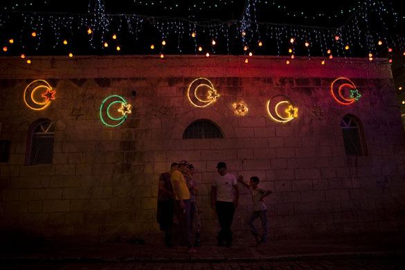 24 hours in pictures: Jerusalem, Israel: Palestinians smoke a waterpipe 