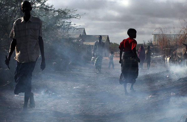 24 hours in pictures: somali refugees live desperate existence in camps in neighboring kenya