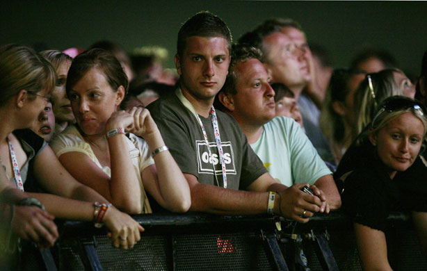 V Festival: A man in the crowd wears an Oasis t-shirt