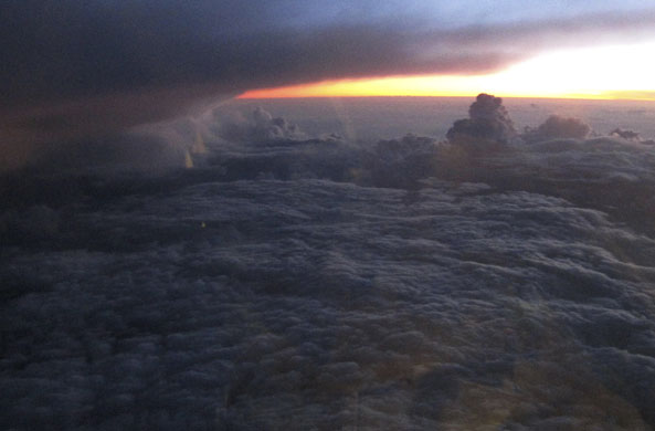 athens update: smoke of wildfires rising through the clouds