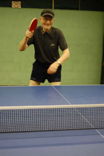 Age Concern Photography: An elderly man plays table tennis