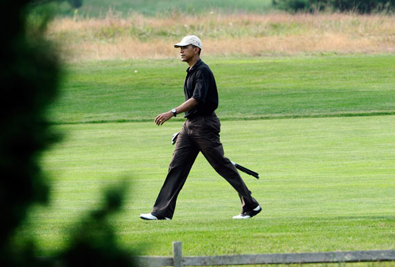 Obama holiday: Barack Obama walks on the Farm Neck Golf Course in Oak Bluffs
