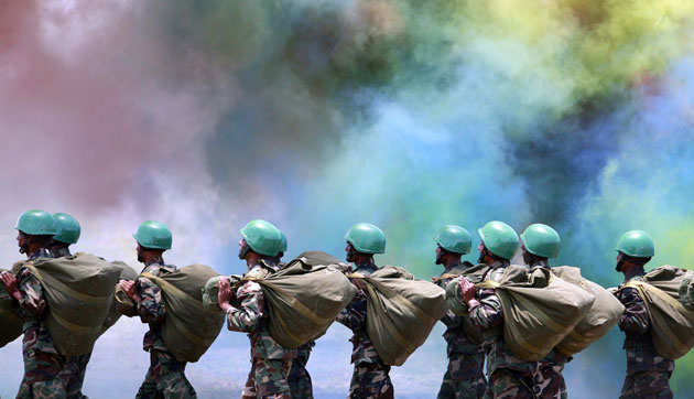 24 hours in pictures: Army commandos march past coloured smoke in eastern Sri Lanka
