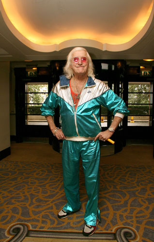 Tracksuits: Jimmy Savile wearing a shiny green Nike shellsuit