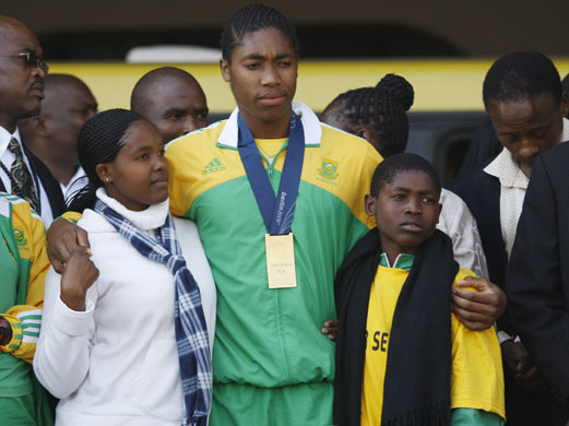 Caster Semenya: Caster Semenya is hugged by un-named family members
