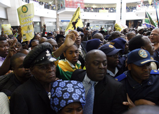 Caster Semenya: Caster Semenya is escorted by police and officials 