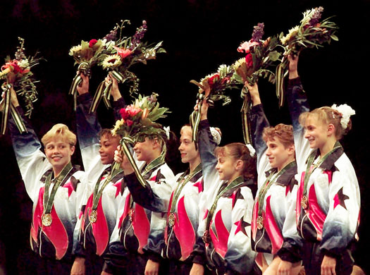 Tracksuits: Members of the United States women's gymnastics team wave to the crowd