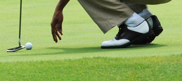 Obama on vacation: Barack Obama on the 9th hole at the the Mink Meadows Golf Course