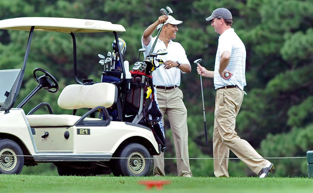Obama on vacation: Barack Obama on the Mink Meadows Golf Course with White House trip director