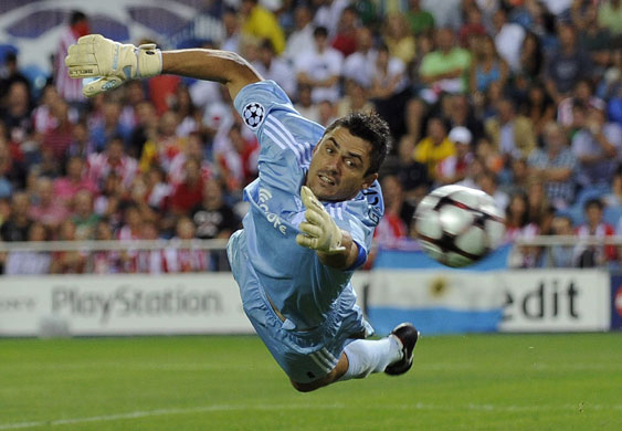 champions league: Panathinaikos goalkeeper Mario Galinovic dives to his left to make a save