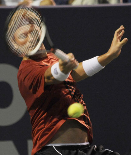 24sport: Mardy Fish returns a shot to Rajeev Ram