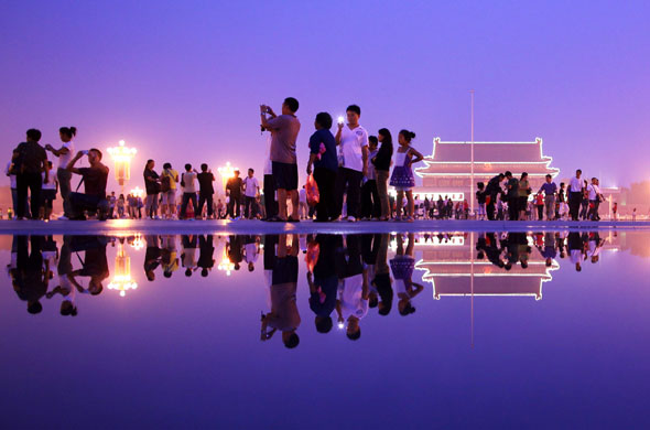 26 August 2009: Beijing, China: Tourists visit Tiananmen Square