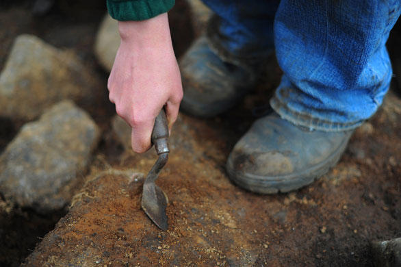 Summer digs: Trowelling at a roundhouse site at Bellever, Dartmoor