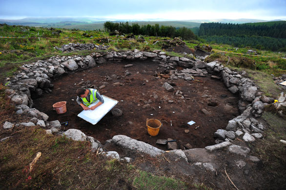 Summer digs: Project Officer Simon Hughes tracing the site plans at Bellever, Dartmoor
