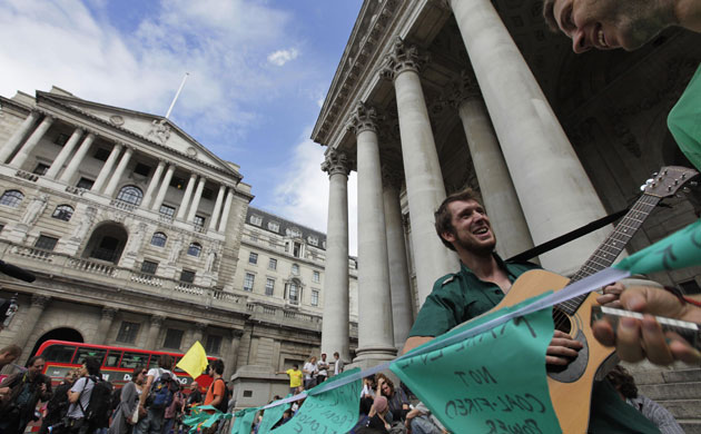 Camp for Climate Action : Protesters sing a song as they gather at the Bank of England