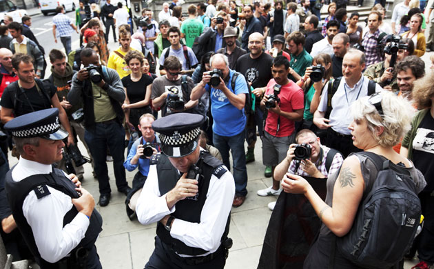 Camp for Climate Action: Policemen under the media spotlight near the Bank of England